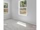 Spacious bedroom with neutral carpeting and large windows at 10611 Audubon Ridge Dr # 26, Cornelius, NC 28031