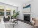 Gathering room with a fireplace and plenty of natural light at 10611 Audubon Ridge Dr # 26, Cornelius, NC 28031