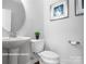 Clean and updated bathroom with a pedestal sink and toilet at 10611 Audubon Ridge Dr # 26, Cornelius, NC 28031