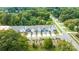 Aerial view of townhouses situated on a tree-lined street at 10611 Audubon Ridge Dr # 26, Cornelius, NC 28031