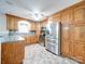 Bright kitchen with stainless steel appliances and oak cabinetry at 168 Marlow Woods Ln, Statesville, NC 28625