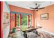Bright dining area with wood table, treetop views, and slate floor at 640 Davie Ave, Statesville, NC 28677