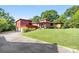 Red mid-century modern home with a large yard and attached garage at 640 Davie Ave, Statesville, NC 28677