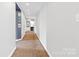 Long hallway with patterned carpet and neutral walls at 640 Davie Ave, Statesville, NC 28677