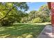 Green lawn with mature trees and a side yard at 640 Davie Ave, Statesville, NC 28677