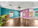 Spacious game room with built-in shelving and hardwood floors at 640 Davie Ave, Statesville, NC 28677