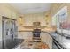 Kitchen with stainless steel appliances and light-colored cabinets at 640 Davie Ave, Statesville, NC 28677