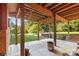 Covered patio with fire pit and backyard view at 640 Davie Ave, Statesville, NC 28677