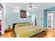 Bedroom with platform bed, wood floors, and access to bathroom at 640 Davie Ave, Statesville, NC 28677
