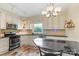 Kitchen with stainless steel appliances and light-colored cabinets at 640 Davie Ave, Statesville, NC 28677