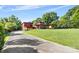 Mid-century modern home with attached garage and expansive lawn at 640 Davie Ave, Statesville, NC 28677