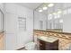 Clean bathroom with white cabinets and decorative tile at 640 Davie Ave, Statesville, NC 28677