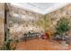 Sunken entry with stone walls, potted plants, and wooden tiger statue at 640 Davie Ave, Statesville, NC 28677