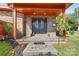 Brick front porch with double doors and decorative glass at 640 Davie Ave, Statesville, NC 28677