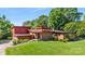 Mid-century modern home with brick and red siding, steps leading to entry at 640 Davie Ave, Statesville, NC 28677