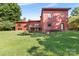 Spacious backyard with lush green grass and mature trees at 640 Davie Ave, Statesville, NC 28677