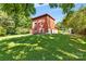 Attached garage with modern doors and a red exterior at 640 Davie Ave, Statesville, NC 28677