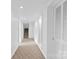 Long hallway in the basement with carpeted flooring at 640 Davie Ave, Statesville, NC 28677