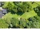 Aerial view showing house and large lot with surrounding trees at 640 Davie Ave, Statesville, NC 28677