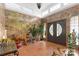 Spacious entry with tile floor, decorative plants, and stained-glass door at 640 Davie Ave, Statesville, NC 28677
