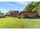 Mid-century modern brick home with a spacious lawn at 640 Davie Ave, Statesville, NC 28677