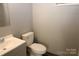 Clean bathroom with a toilet, sink, and shower/tub combo at 410 Clinton Dr, Kings Mountain, NC 28086