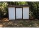 White shed with brown trim in the backyard at 410 Clinton Dr, Kings Mountain, NC 28086