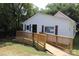 White house with wooden ramp and deck at 410 Clinton Dr, Kings Mountain, NC 28086