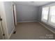 Bright bedroom with carpet, neutral walls, and a closet at 410 Clinton Dr, Kings Mountain, NC 28086