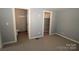 Bedroom with carpet, closet, and access to a full bathroom at 410 Clinton Dr, Kings Mountain, NC 28086