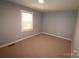 Spacious bedroom with neutral walls and carpet at 410 Clinton Dr, Kings Mountain, NC 28086