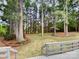 Wooded backyard with a deck and open grassy area at 138 Bufflehead Dr, Mooresville, NC 28117