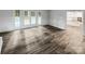 Spacious living area with wood-look floors and views of the backyard at 138 Bufflehead Dr, Mooresville, NC 28117