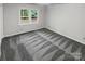 Simple bedroom with grey carpeting and natural light at 138 Bufflehead Dr, Mooresville, NC 28117