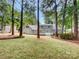 House with a deck and wooded backyard at 138 Bufflehead Dr, Mooresville, NC 28117