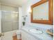 Clean bathroom with a shower/tub combo, vanity, and large mirror at 192 Clearview Point Dr, Mount Gilead, NC 27306