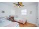 Cozy bedroom with twin beds, hardwood floors, and plenty of natural light at 192 Clearview Point Dr, Mount Gilead, NC 27306