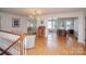Open dining room with hardwood floors and sunroom access at 192 Clearview Point Dr, Mount Gilead, NC 27306