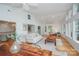 Spacious living room with hardwood floors, large windows and comfortable seating at 192 Clearview Point Dr, Mount Gilead, NC 27306
