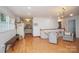 Open floor plan with hardwood floors, kitchen, and stairway at 192 Clearview Point Dr, Mount Gilead, NC 27306