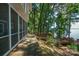 Lakefront home with wooden deck and stairs leading to the water at 192 Clearview Point Dr, Mount Gilead, NC 27306