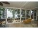 Relaxing screened porch with lake view and swing at 192 Clearview Point Dr, Mount Gilead, NC 27306