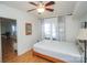 Bedroom with double bed, hardwood floors, and access to lake view at 192 Clearview Point Dr, Mount Gilead, NC 27306