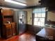 Kitchen area with stainless steel refrigerator and wood cabinetry at 655 Lippard Rd, Salisbury, NC 28146