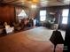 Living room with hardwood floors, large windows, and a ceiling fan at 655 Lippard Rd, Salisbury, NC 28146