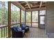 Relaxing screened porch with wicker chairs and wooded views at L4 Marietta Rd # 4, Mooresville, NC 28117