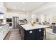 Modern kitchen with island, stainless steel appliances, and white cabinets at L4 Marietta Rd # 4, Mooresville, NC 28117