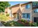 Front view of a tan and brick condo building at 411 Broad E St # B4, Statesville, NC 28677