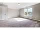 Bright bedroom with carpet and large window at 2024 Cedar Falls Dr # 9, Waxhaw, NC 28173