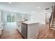 Modern kitchen with white cabinets, island, and stainless steel appliances at 2024 Cedar Falls Dr # 9, Waxhaw, NC 28173